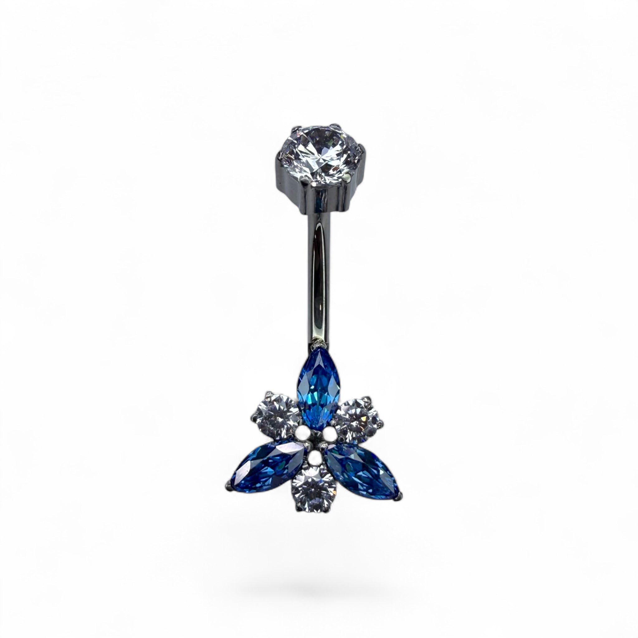 Piercing ombelico in titanio con fiore blu e dettagli luminosi